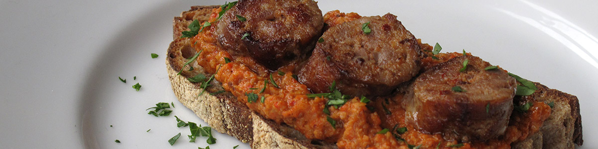 Crostini with Romesco Sauce and Grilled Sausage